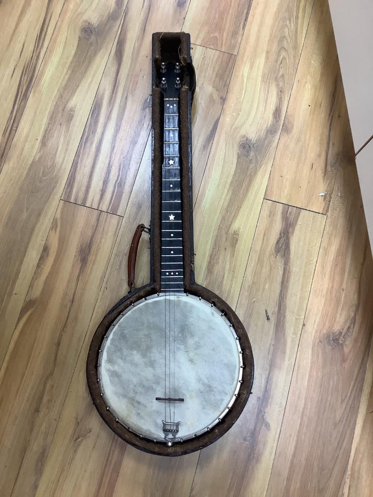 A cased banjo, unmarked